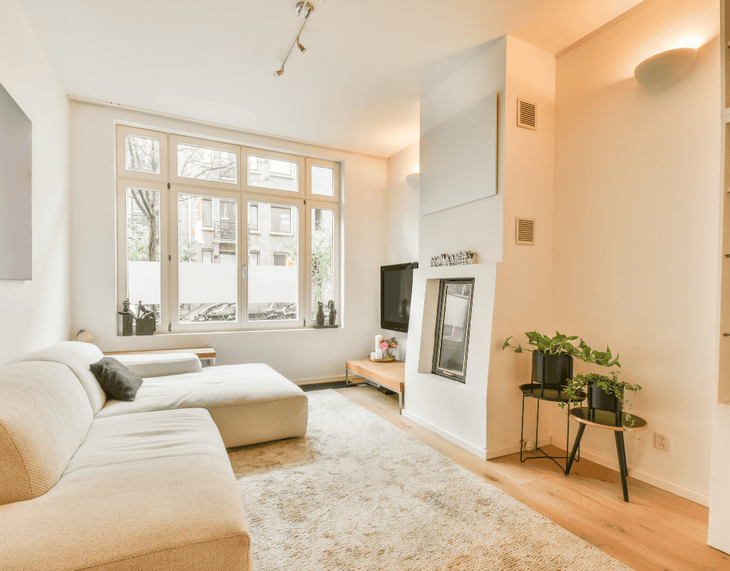 clean and organized living room with polished floors and furniture
